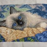 cross stitch charming cat with blue eye kitten on colorful blanket