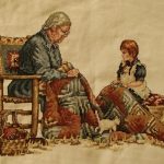 cross stitch grandmas quilt with little girl,