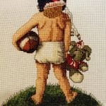 cross stitch in training, little girl with helmet, football and toy