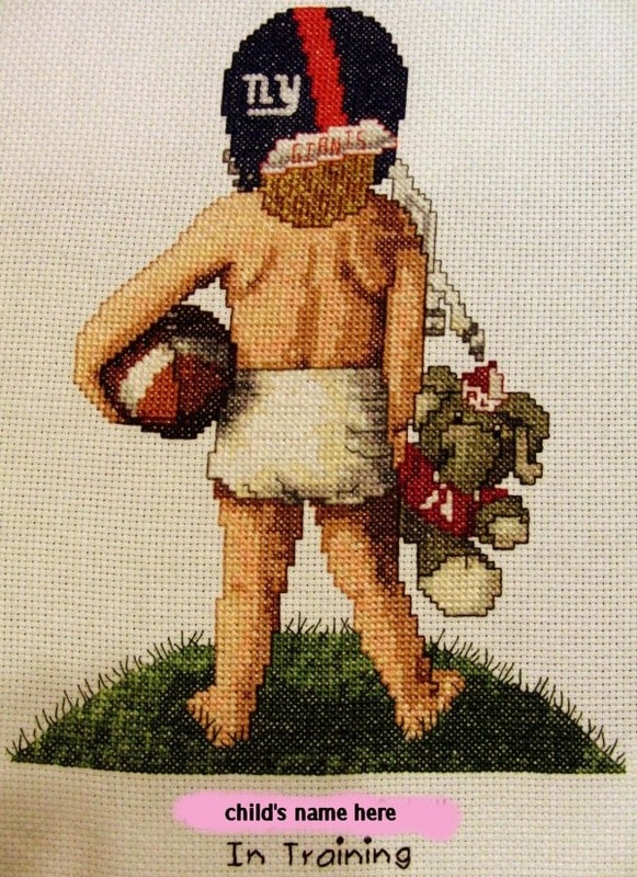 cross stitch in training, little girl with helmet, football and toy