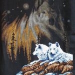 cross stitch night with northern lights, wolves, snowy rocks and trees
