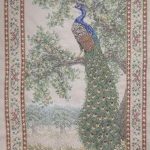 cross stitch peacock tapestry, colorful peacock sitting on tree branch with floral border and beads