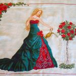 cross stitch queen of water with elegant lady long green dress, watering roses, model stitching.