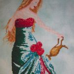 cross stitch queen of water with elegant lady long green dress, watering roses, model stitching