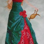 cross stitch queen of water with elegant lady long green dress, watering can, model stitching