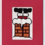 cross stitch christmas card with santa boots in chimney
