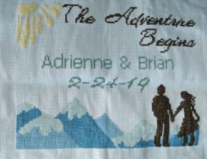 Adventure Begins Wedding cross stitch project with couple, mountains