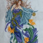 cross stitch mermaid magazine, orange fish, blue, purple dress